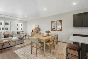 Dining space with light hardwood / wood-style floors