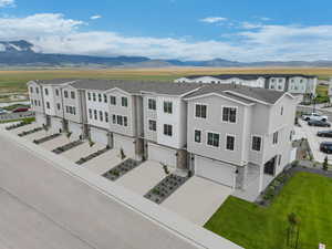 Birds eye view of property with a mountain view