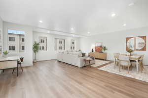 Living room with light hardwood / wood-style flooring