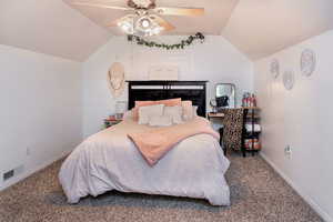 Upstairs bedroom #2 with lofted ceiling and ceiling fan