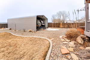 View of yard featuring a carport