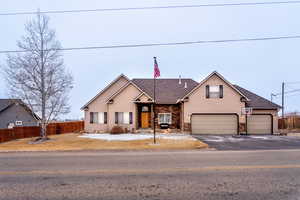 View of front facade featuring a 4 car garage