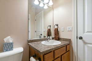 Bathroom with vanity and toilet