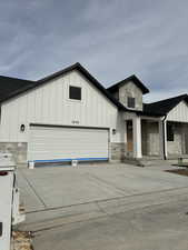 View of front facade featuring a garage