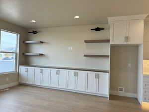 Interior space featuring light hardwood / wood-style flooring and a textured ceiling