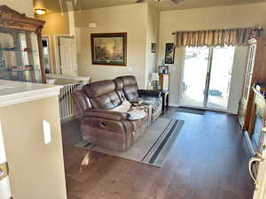 Living room with dark hardwood / wood-style flooring