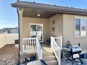 Property entrance featuring a wooden deck