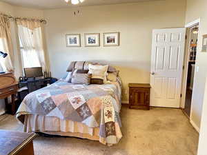 Bedroom with light colored carpet