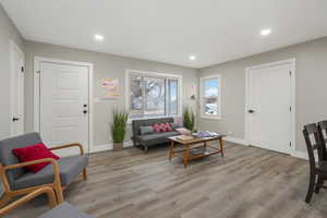 Living area with light hardwood / wood-style floors