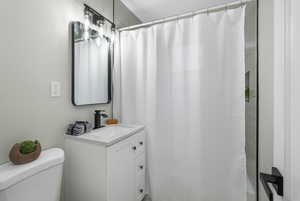 Bathroom featuring vanity and toilet