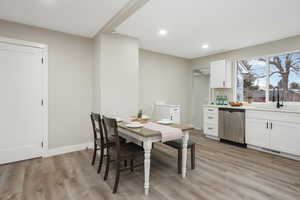 Dining space featuring light hardwood / wood-style floors and sink