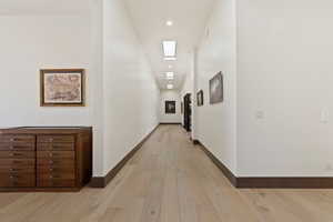 Hallway featuring light wood-type flooring