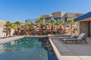 View of swimming pool with a patio area