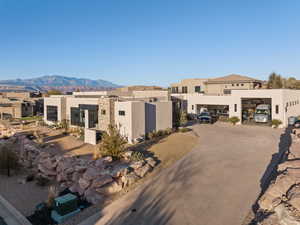 Pueblo-style home featuring a mountain view