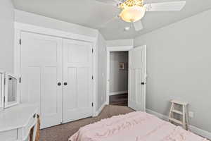 Bedroom featuring ceiling fan and a closet