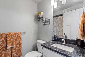 Bathroom with vanity and toilet