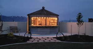 Exterior space with a gazebo and a mountain view