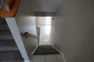 Stairway featuring tile patterned flooring