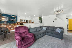 Living room with light hardwood / wood-style floors