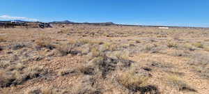 Property view of mountains with a rural view