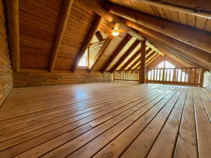 Loft featuring newly refinished hardwood floors