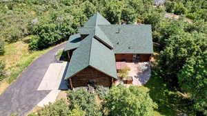 View of subject property featuring a heavily wooded area