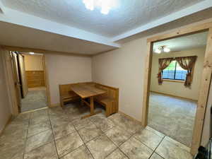 Basement dining area & bedroom off the kitchen