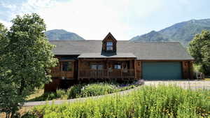 Side of home with a large deck
