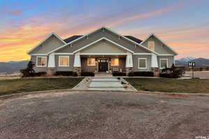 Craftsman-style house featuring a mountain view and a lawn