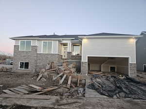 View of front of property featuring a garage