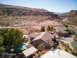 Birds eye view of property with a mountain view