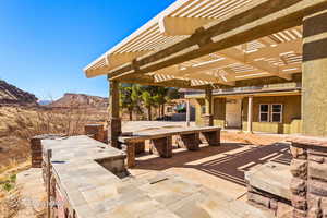 View of patio / terrace featuring a mountain view and a pergola