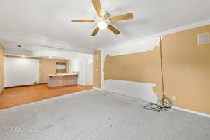 Interior space featuring ceiling fan and a textured ceiling