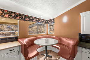 Sitting room featuring breakfast area and a textured ceiling