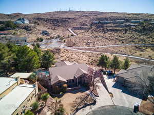 Birds eye view of property with a mountain view