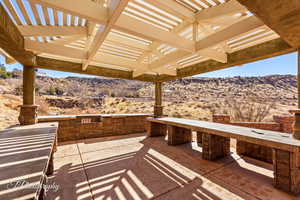 View of patio / terrace with a mountain view and a pergola