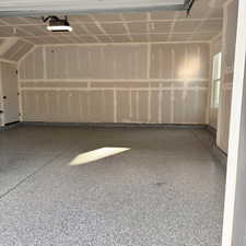 Garage featuring a garage door opener