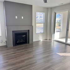 Unfurnished living room with hardwood / wood-style floors