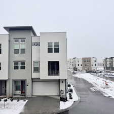 View of front facade featuring a garage