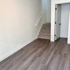 Staircase with hardwood / wood-style floors