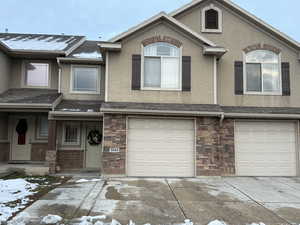 View of front facade featuring a garage