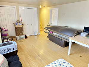 Game room with wood-type flooring