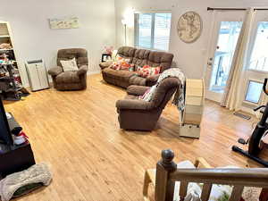 Living room with hardwood / wood-style floors