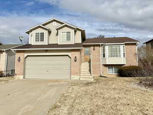 Split level home featuring a garage