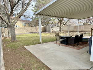 View of patio / terrace featuring a storage unit