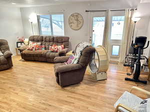 Living room featuring a textured ceiling and light wood-type flooring