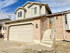 View of front facade featuring a garage