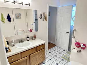 Bathroom featuring vanity and toilet