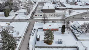 Snowy aerial view with a residential view