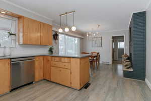 Kitchen with updated appliances, light fixtures, flooring, quartz countertops